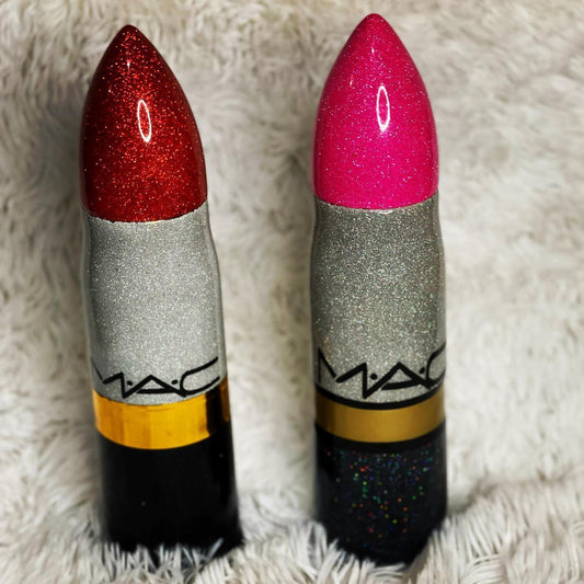 Two Mac Lipstick Thermos tumblers with sparkling glitter finishes in red and pink colors, featuring a Mac logo on the side.